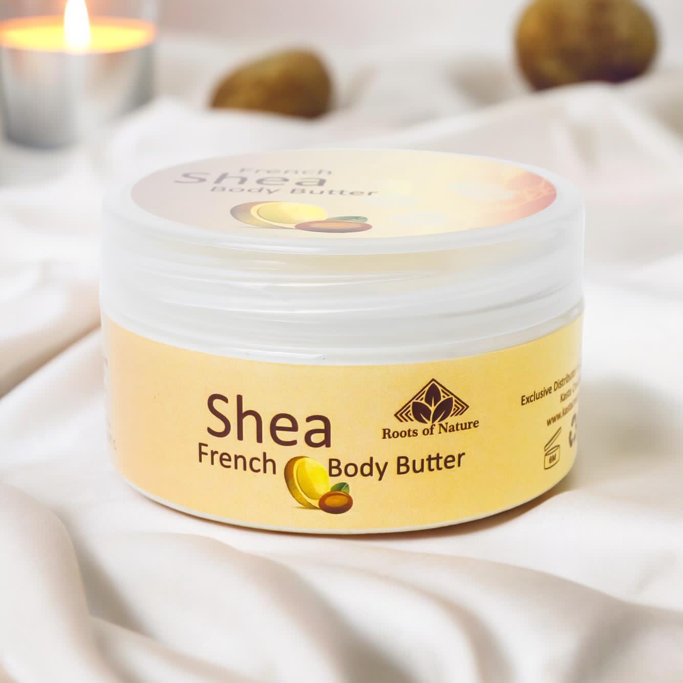 Jar of Shea French Body Butter with a candle in the background